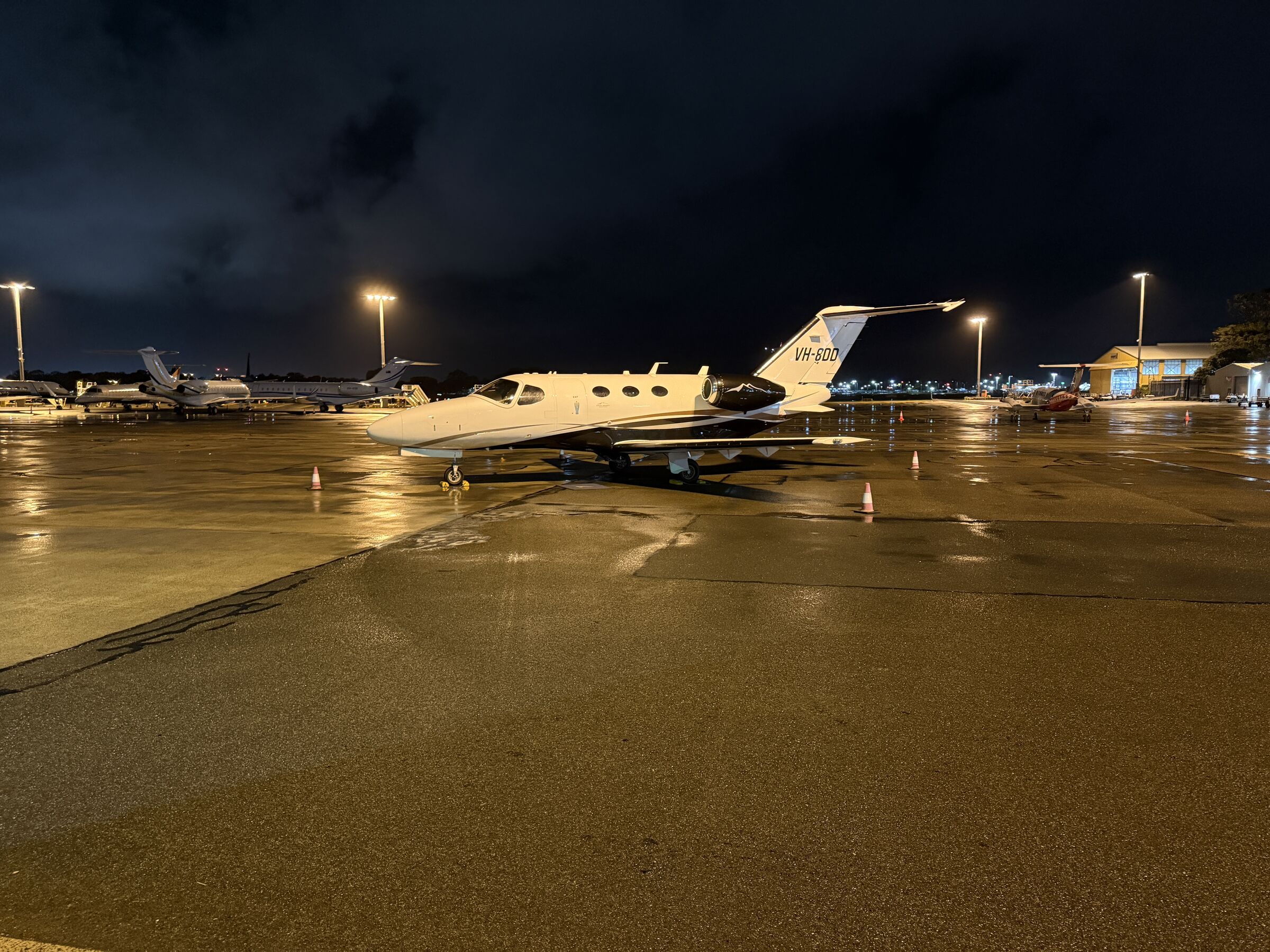 Cessna Citation Mustang VH-8DD on the ramp at night